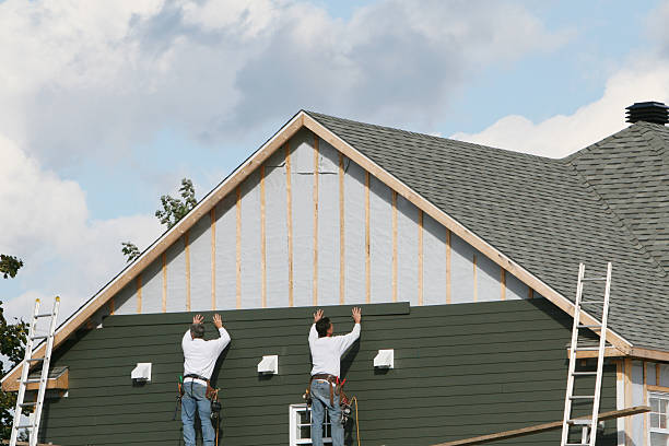 Professional Siding technician working in Denton, MD